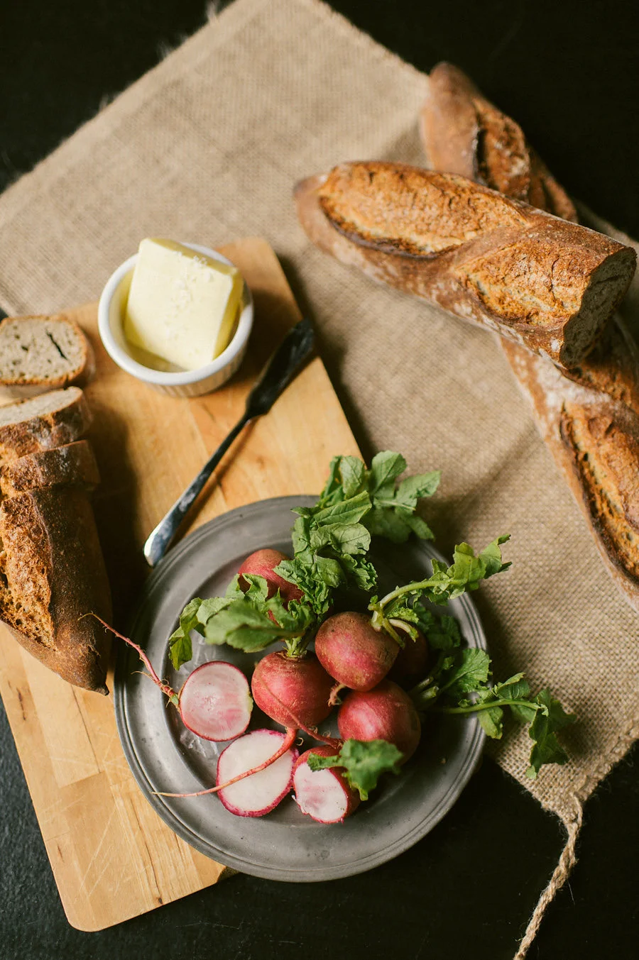 radish-rustic-baguette-cutting-board-burlap-food-styling