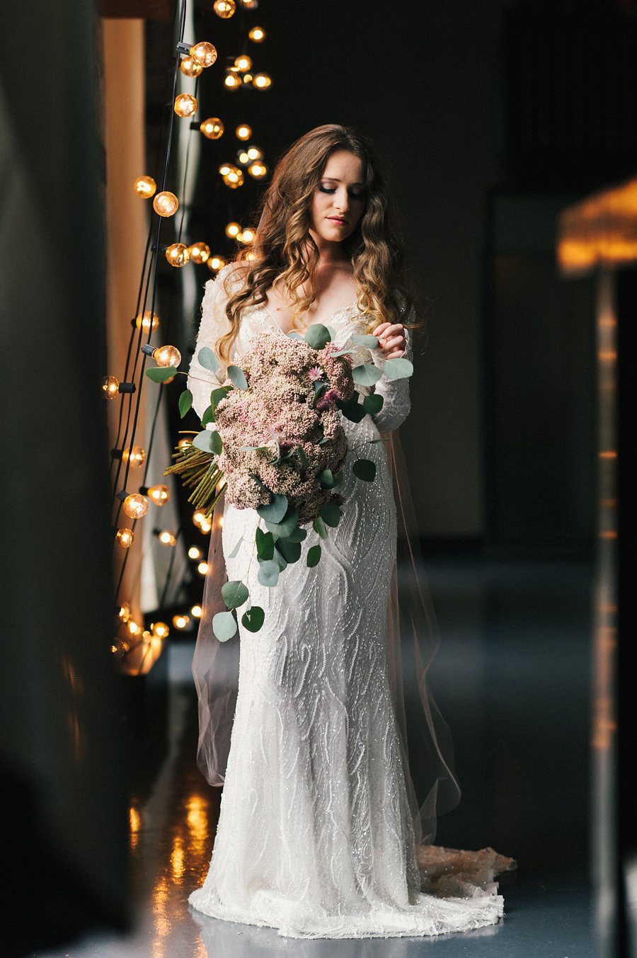 the-green-building-bride-string-lights-long-sleeve-dress-unique-bouquet