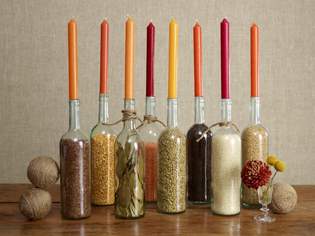 thanksgiving-fall-centerpiece-decorating-candles-wine-bottles-grains-orange-yellow-red