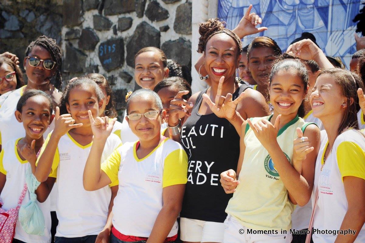 Dara Braddock with Brazilian school children are BEAUTIFUL IN EVERY SHADE. Photo by Melissa Creary