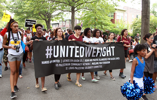 Under the "United We Fight" banner, a broad coalition of community groups and organizers in St. Louis marched together in support of the movement for Black lives. (Photo taken by Carlton Mackey)