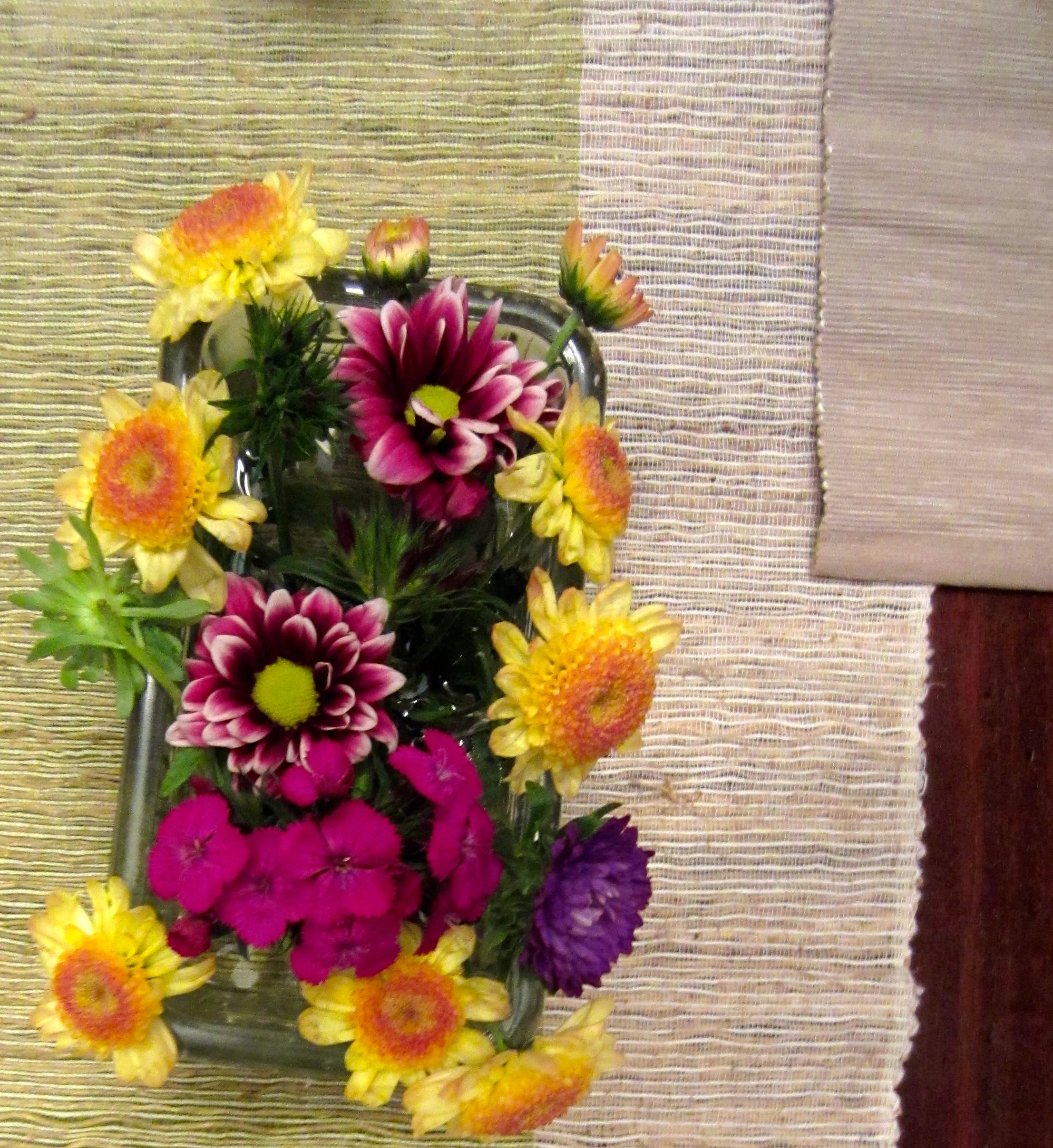 I used an antique salt glass for a short flower arrangement. I hate it when people can't see each other through the flowers. 