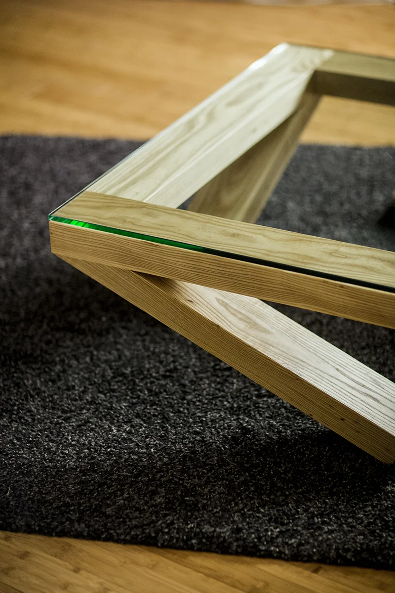 1/2" thick glass is suspended by the 40" square table.