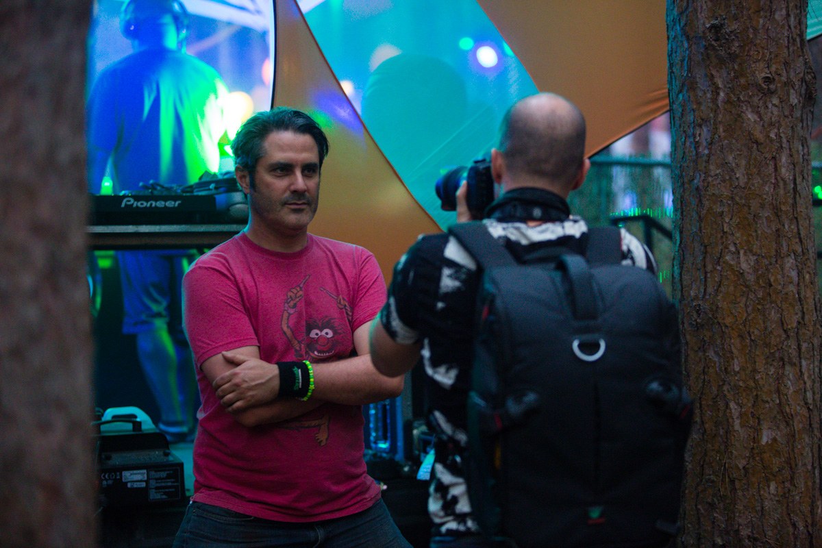 Christian shooting a portrait of Robbie Kowal, DJ Motion Potion, before his set.