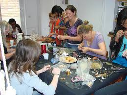 Some happy people here designing their own jewellery at Sam's Workshop day