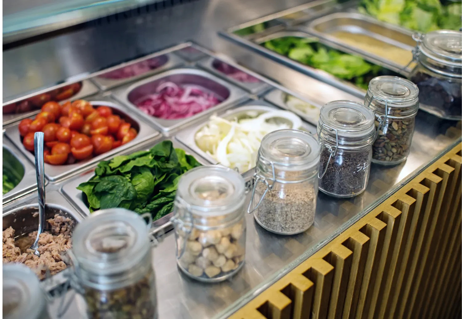 toppings for wraps and salads in a salad bar type setting