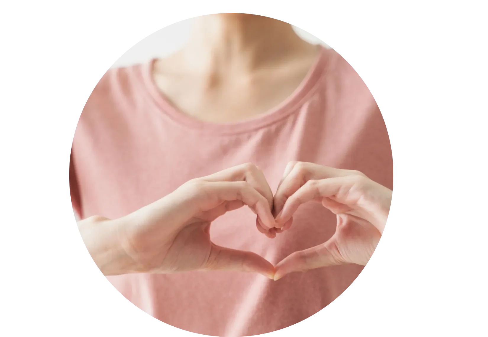 woman making a heart with her hands