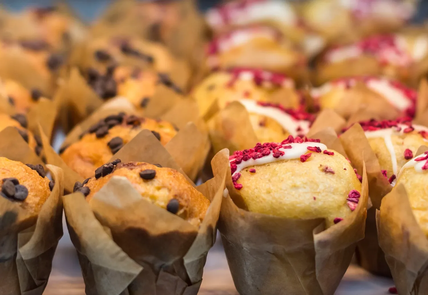 close up image of various artisanal muffins