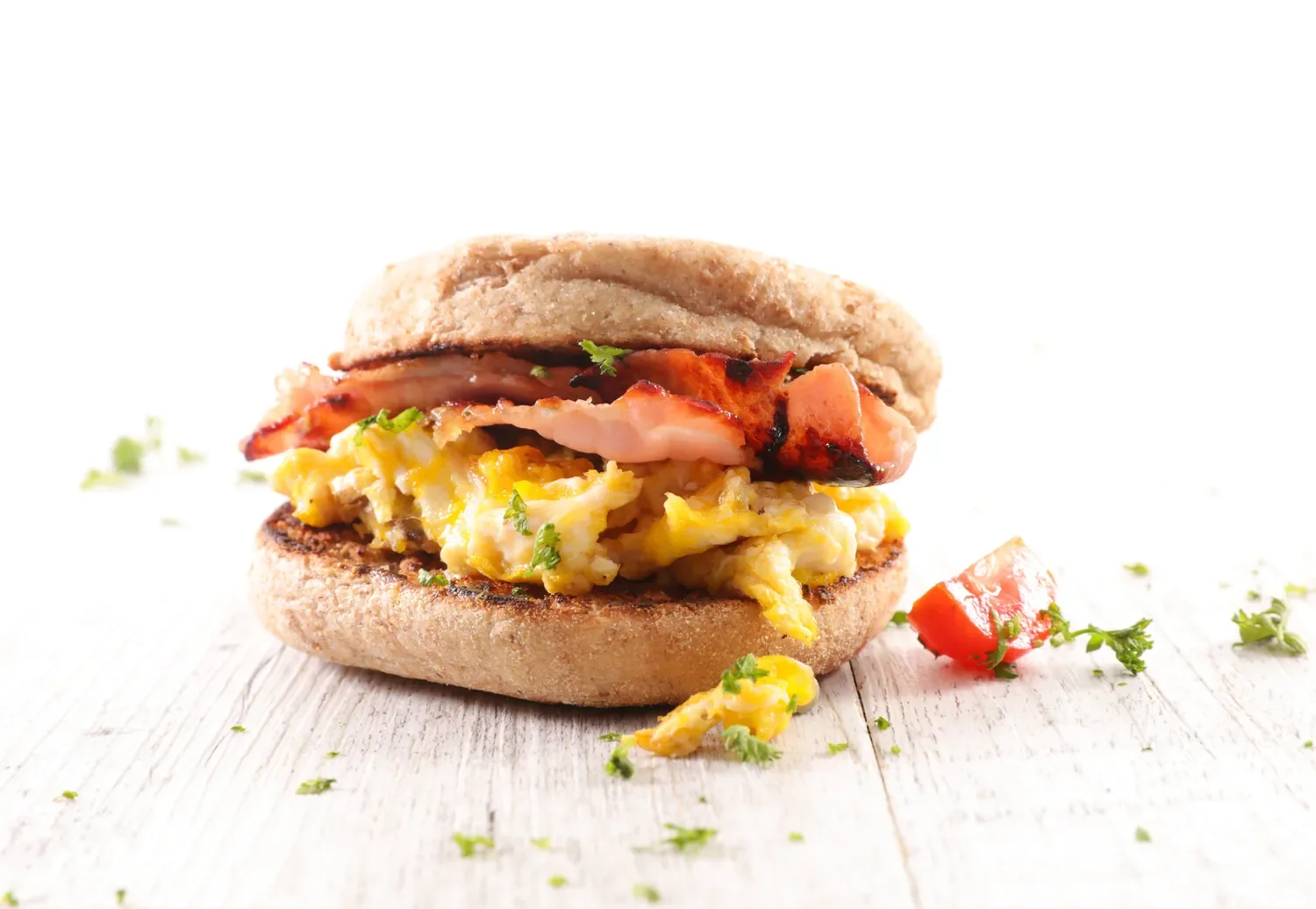 home made bacon and egg breakfast sandwich on an english muffin