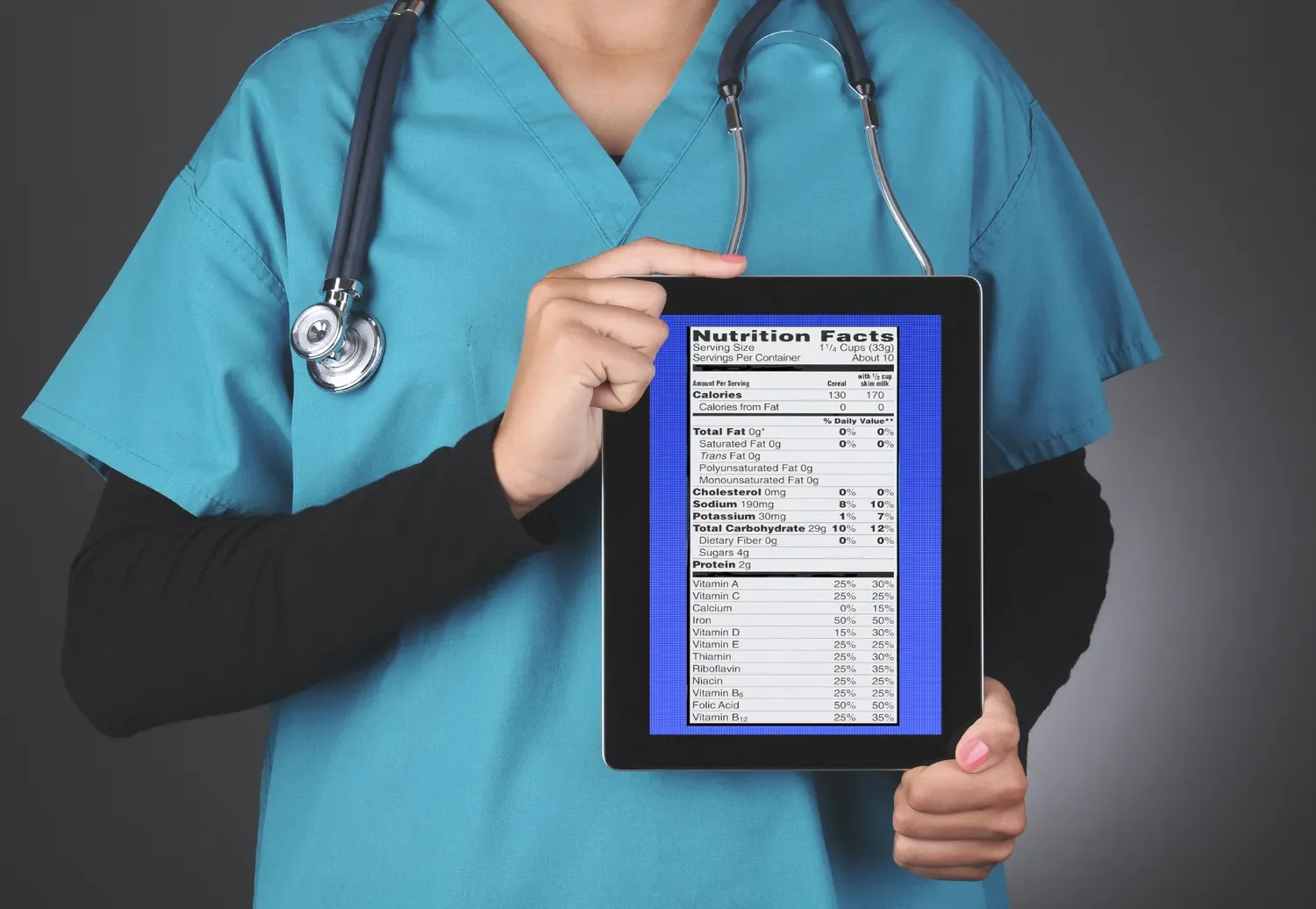 doctor holding a tablet showing a nutrition facts table