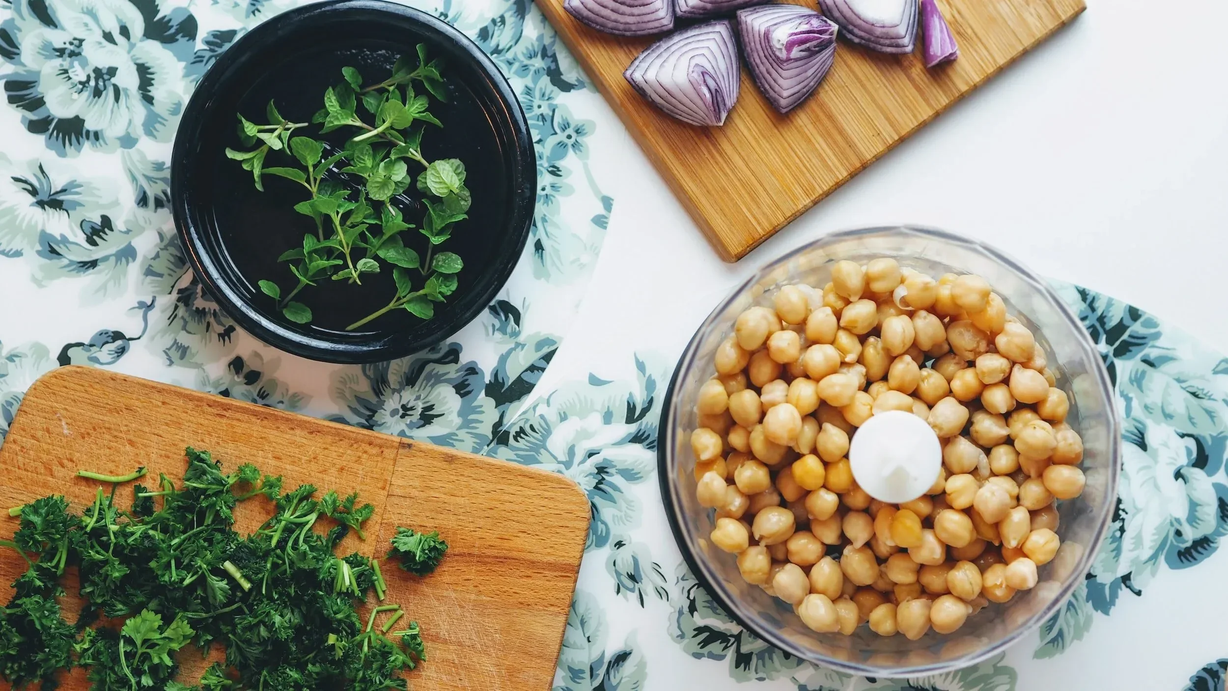 ingredients for hummus chickpeas cilantro on a table