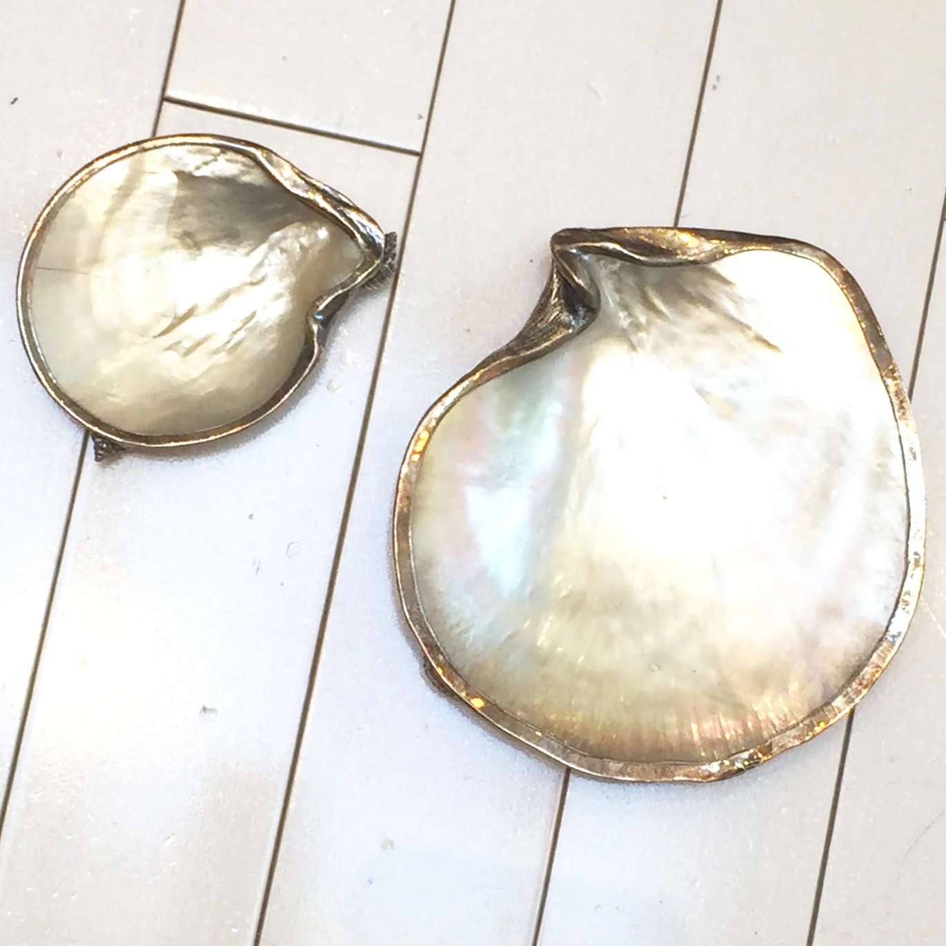 A unique treasure and a safe place to put her earrings at night. Antique Silver Coated Shell Trays