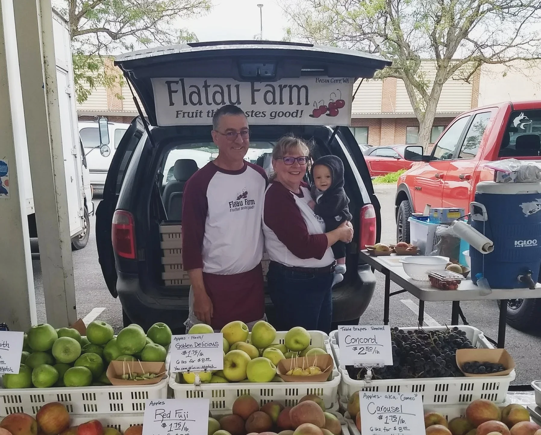 Paul and Sue with Grandson Zane at the Pasco Farmers Market