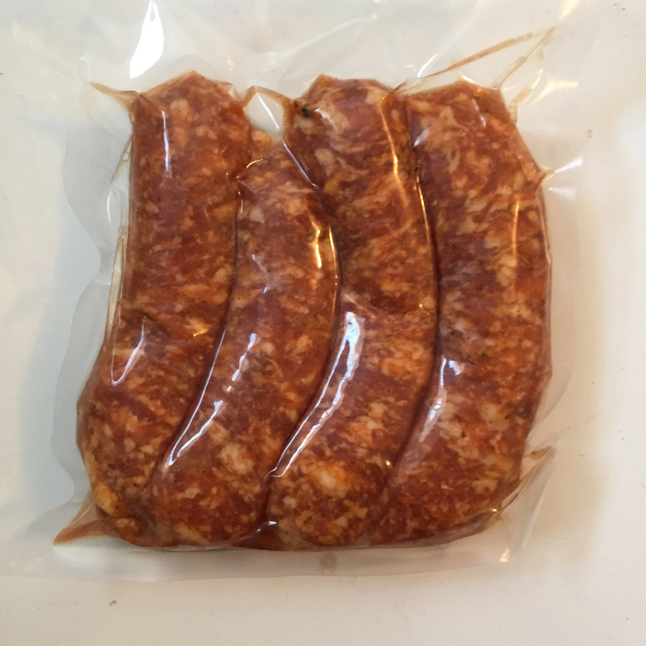 Hot Italian sausages - $8.50/lb, 4 sausages per package, average of 0.8 pounds