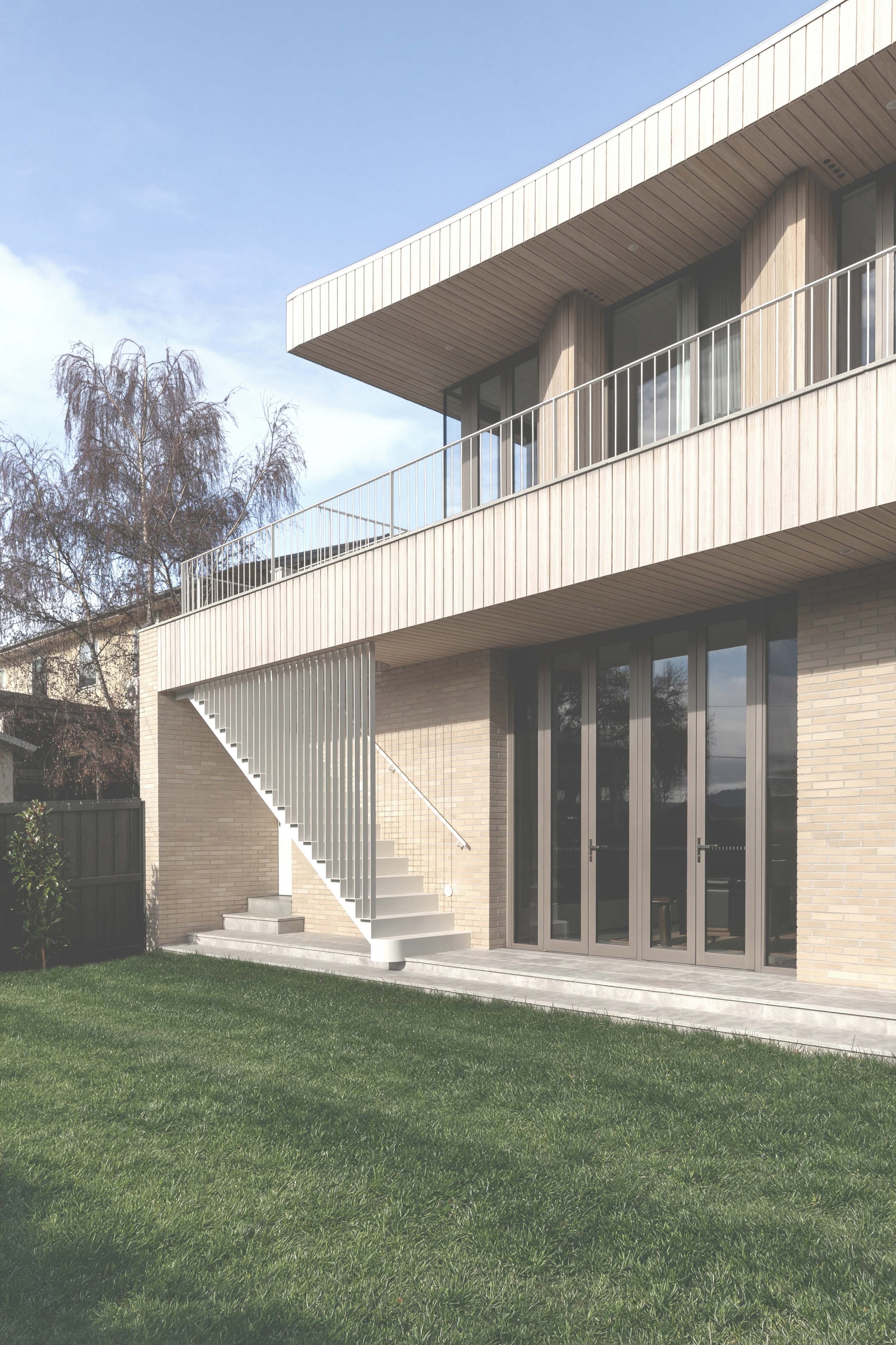 timber house with brick walls and steel stair