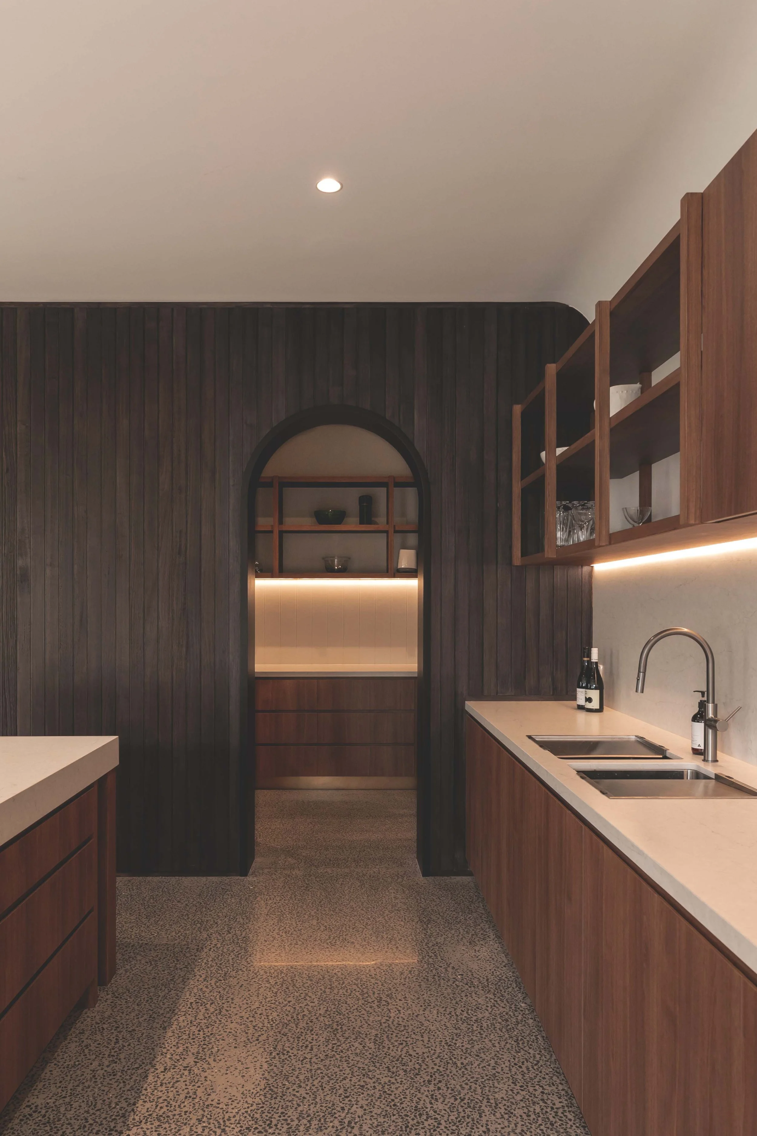 kitchen with arch entry to pantry