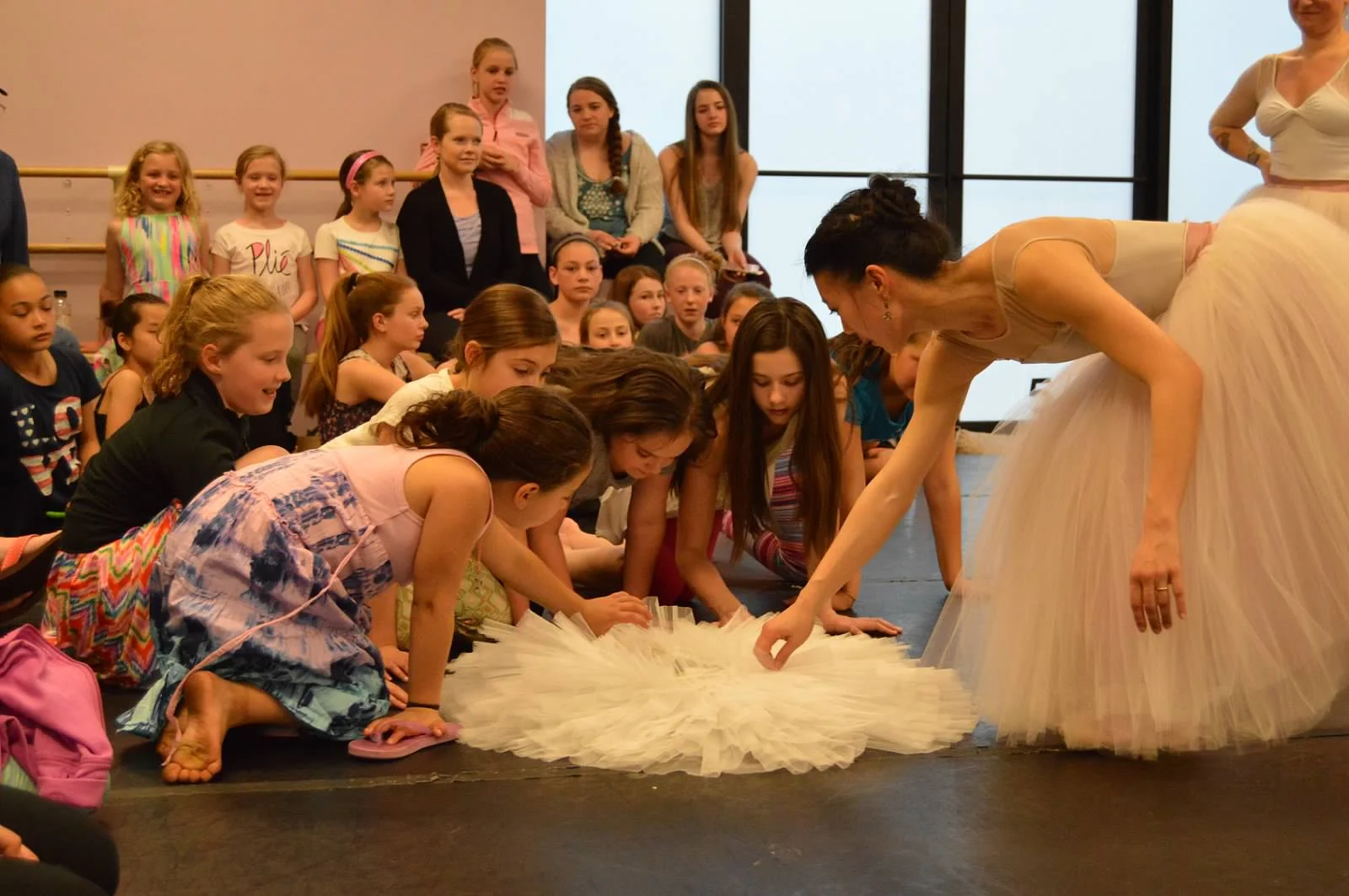 Curious children counting the many layers of tulle it takes to make a tutu. *photo by Kelly Curran McCarthy
