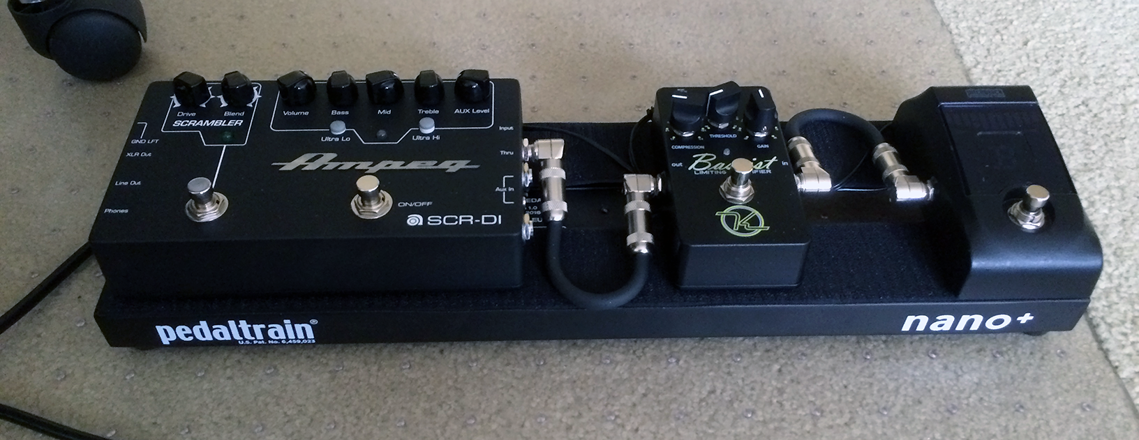 The Pedaltrain Nano+ pedalboard with Cioks DC5 powersupply mounted beneath sitting flat on the floor. The power supply fits perfectly.