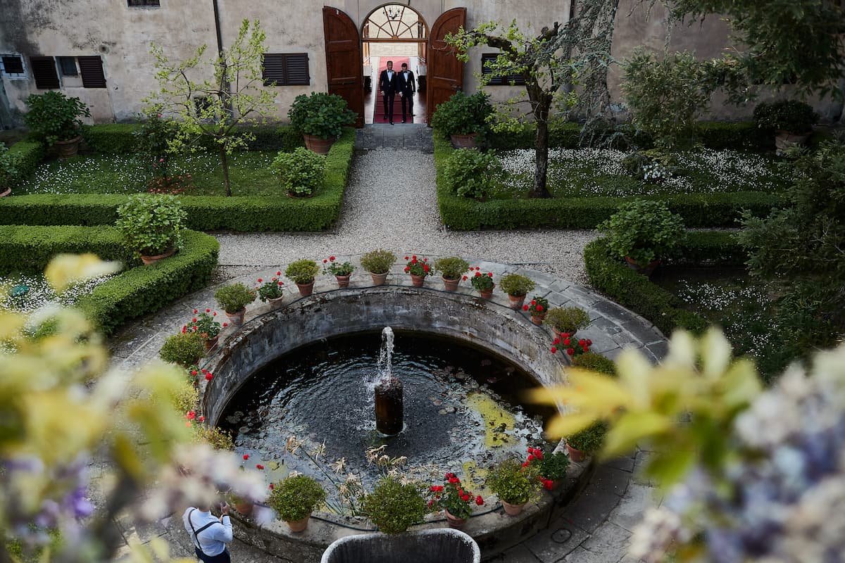 Manuel + Takeshi-courtyard in historic villa for weddings in Tuscany.jpeg