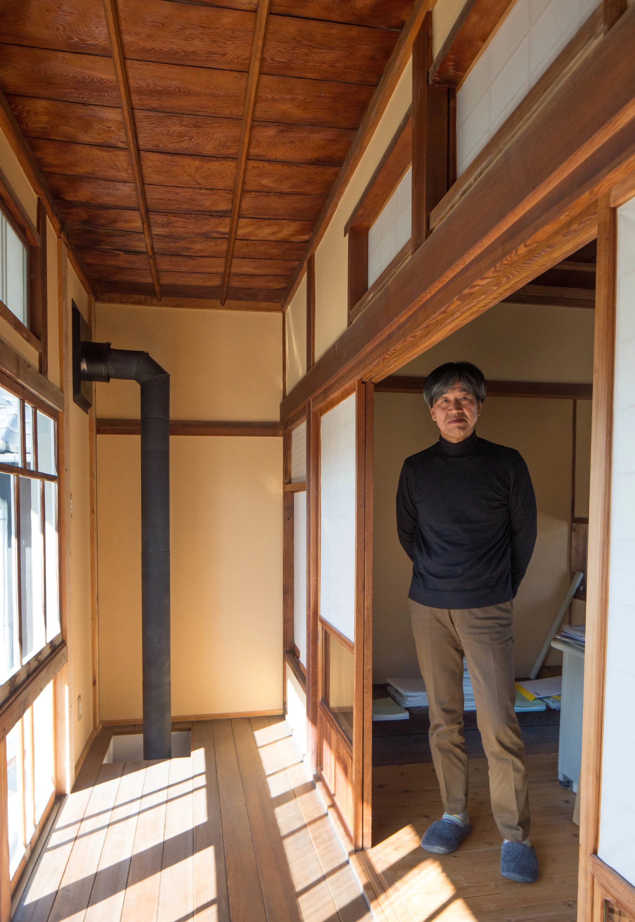 Architect Kenji Saimoto at the entrance to his office. ©TOKI