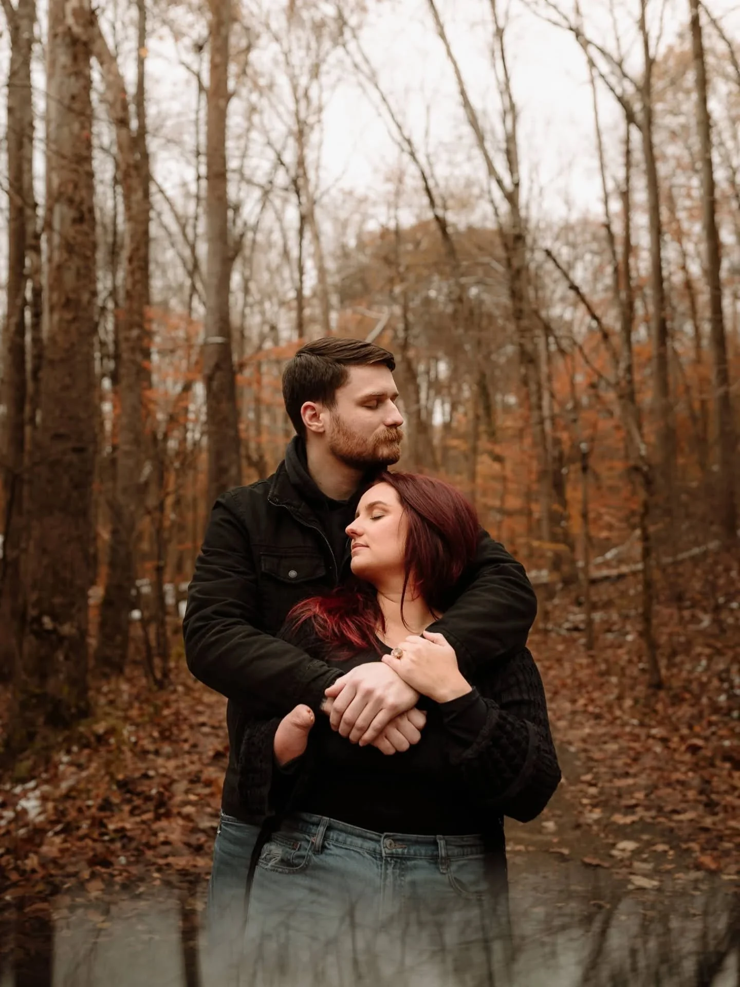 This November engagement session is everything I love about photographing this time of year-- vibrant fall leaves still clinging to the trees, a little snow in the ground left from an early snowfall, and this incredibly wonderful couple cozying up in