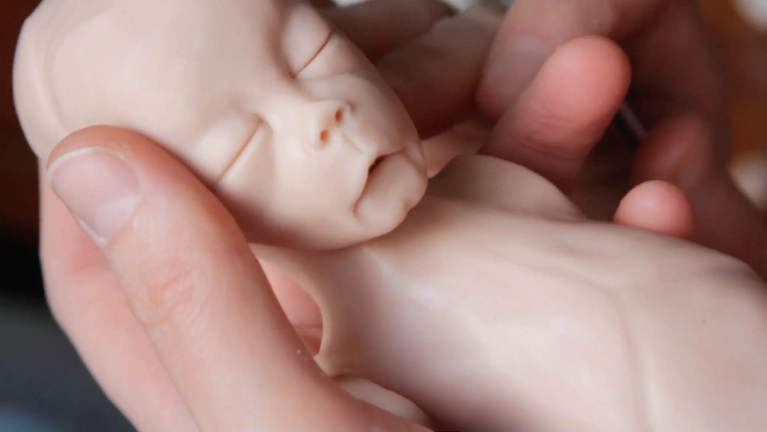 After a personal trauma, Jenn is struggling to process her grief. Eventually she turns to art -- making mementos for others grasping for more in the absence created by the death of a child. Unsettling and reverent, her lifelike sculptures represent the universal struggle of holding on and letting go.