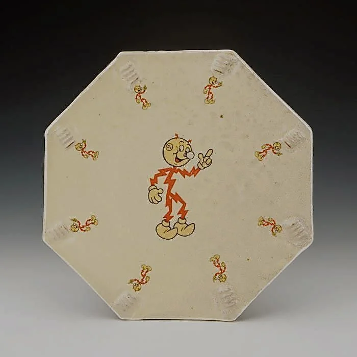 Dan Anderson, Reddy Kilowatt lunch plate, 2014, Stoneware, thrown, stamped and altered (cut), Soda fired and decal fired, 8” diameter.