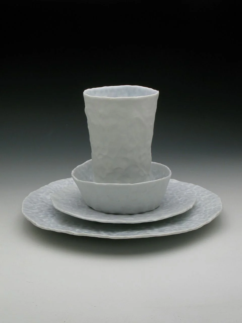 Ingrid Bathe, Place Setting, 4.75" x 10" x 10", porcelain, pinched, cone 10 reduction, 2014 