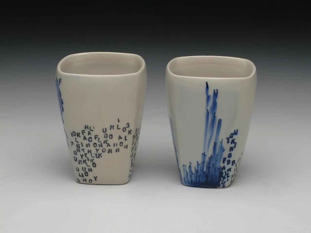 Julia Galloway, Cups with falling letters, square porcelain, soda fire, wheel thrown, 3x3x4", 2014