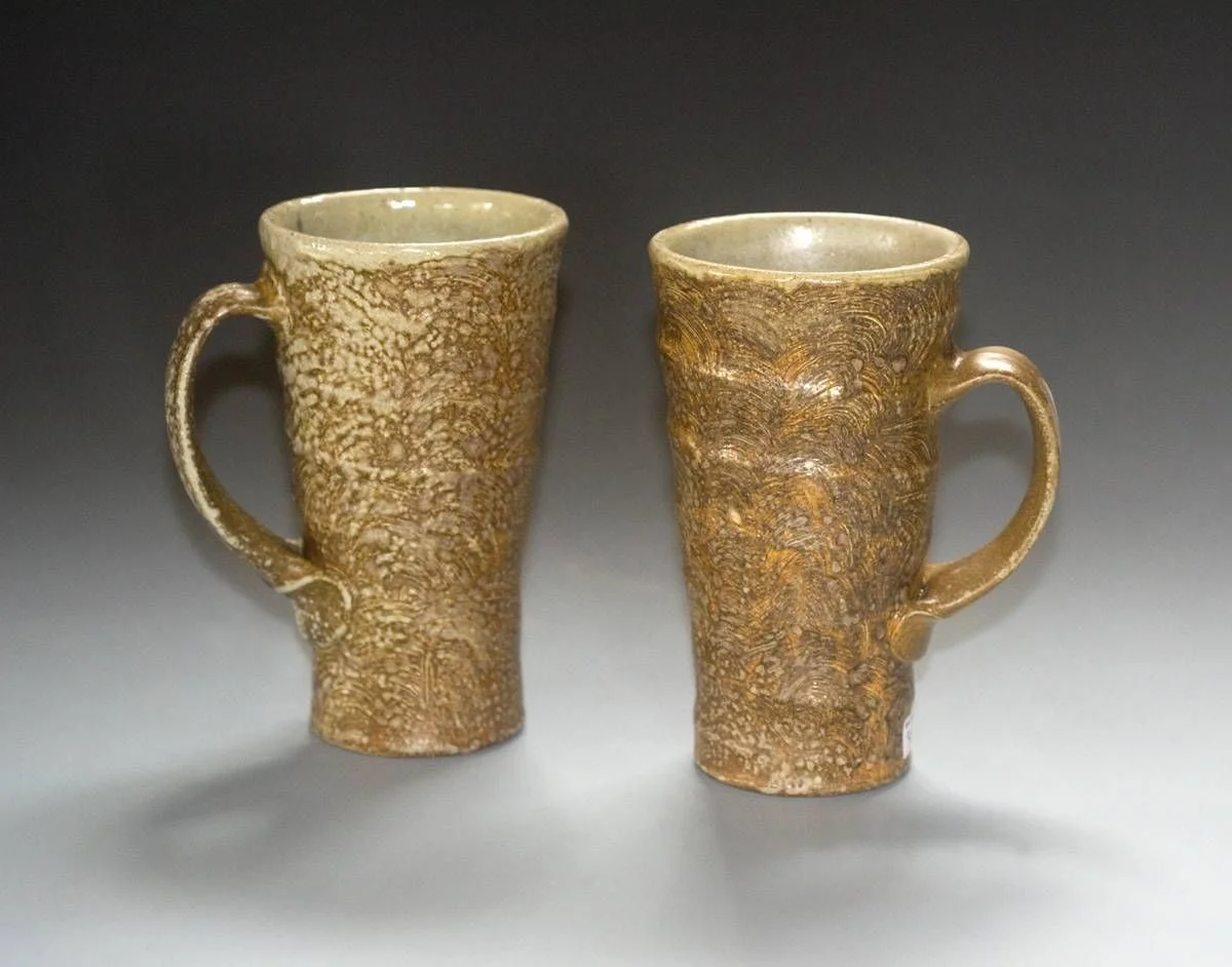Mark Shapiro, Two commuter mugs, 7"h Wood-fired, salt-glazed stoneware with slip, wax and glaze. 2014 