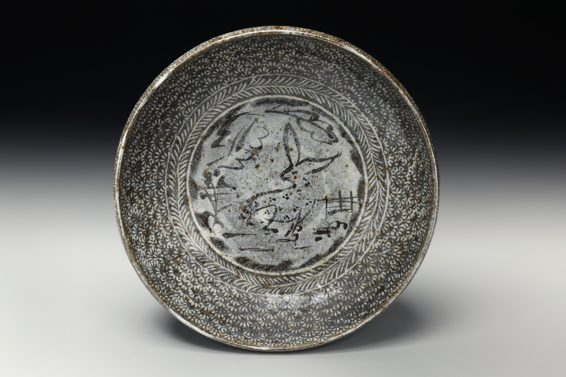 Michael Kline, Bowl with Rabbit, 2015, native NC clay thrown with stamped impressions, white slip inlay, cone 10, 11''x4''