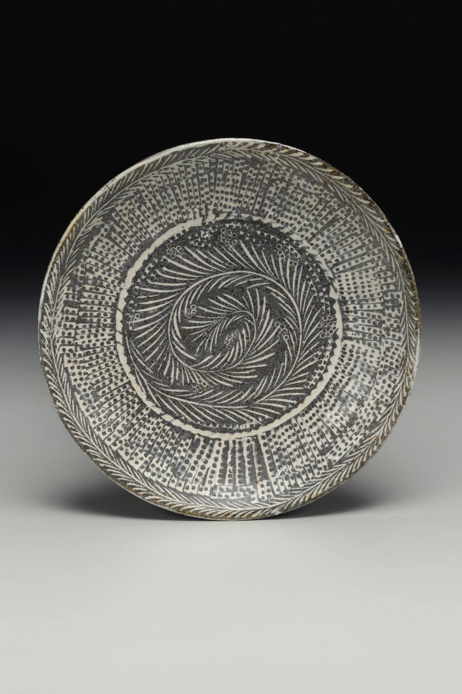 Michael Kline, Carved and Inlay Plate, Native stoneware blend, stamped and carved impressions, porcelain inlay, soda and clear glazes, high fire, 2016