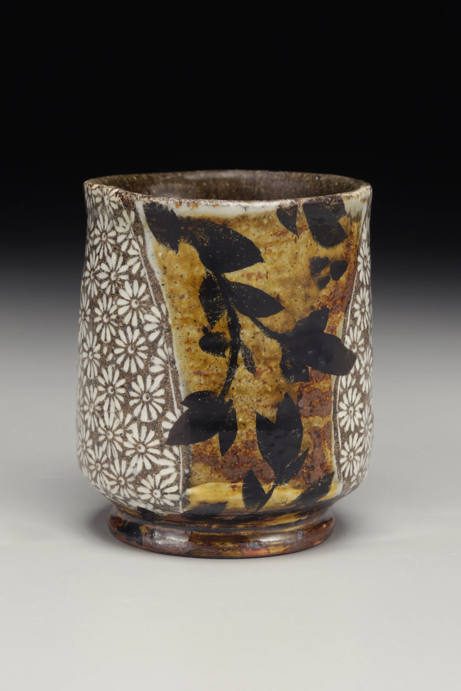 Michael Kline, Yunomi, native stoneware blend, stamped impressions, porcelain inlay, underglaze decoration, soda, iron and clear glazes, high fire, 2016