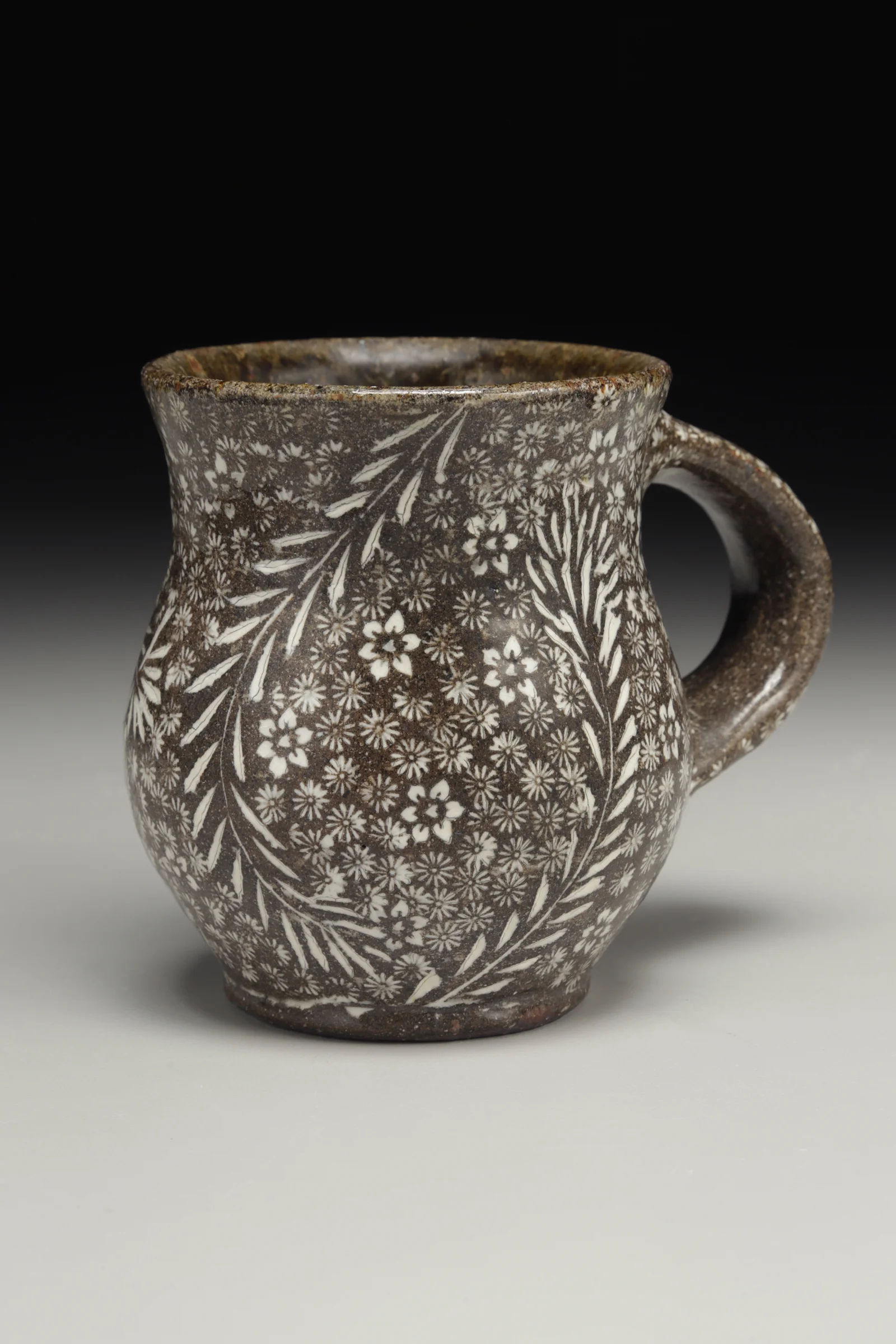 Michael Kline, Mug, native stoneware blend, stamped and carved impressions, porcelain inlay, soda and clear glazes, high fired, 2016