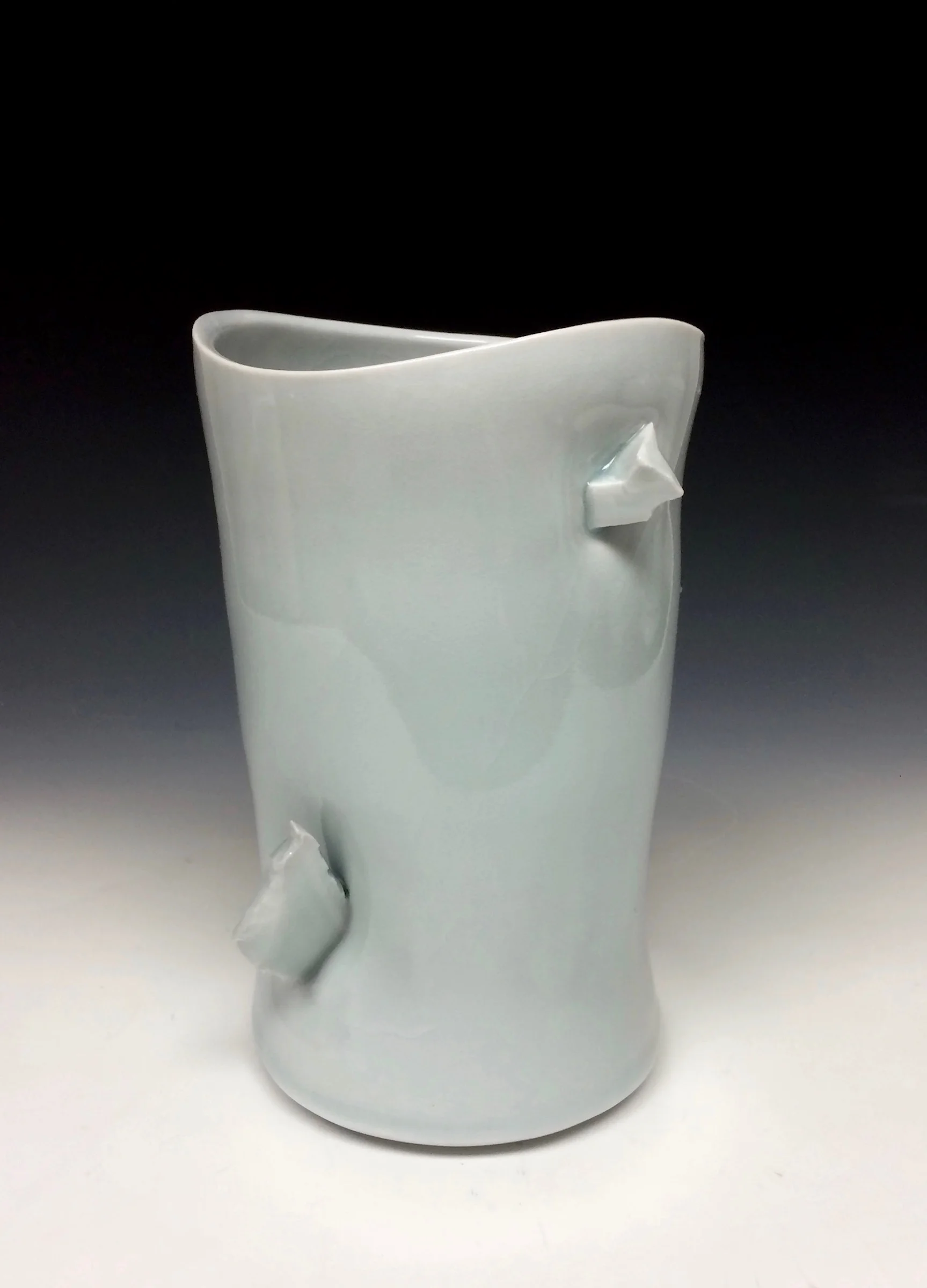 John Oles, Altered Vase, Thrown &amp; Altered porcelain with inclusion, celadon glaze, fired to cone 11 in reduction, 8x7,2016