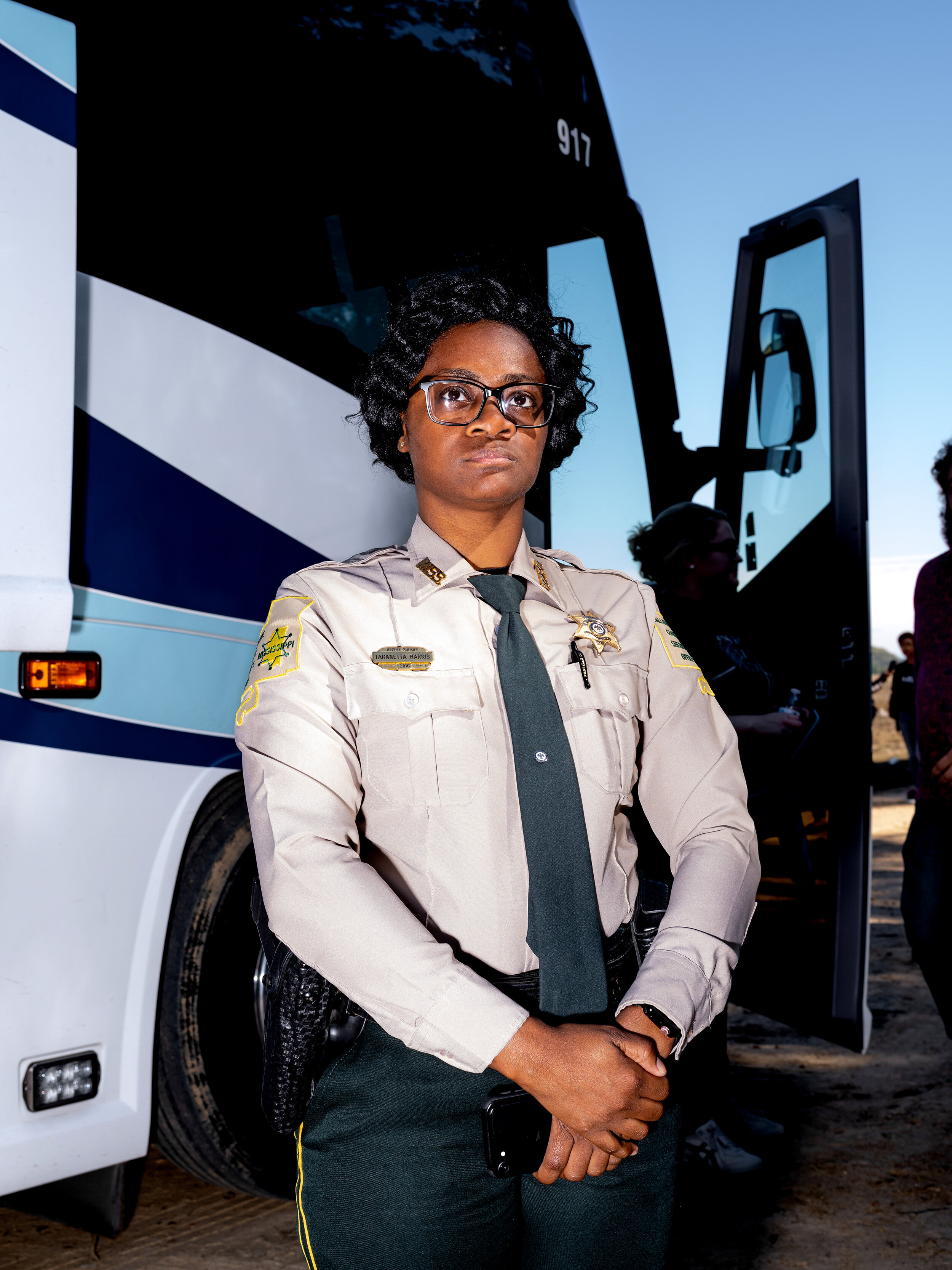  A Tallahatchie County Deputy Sheriff views the newly erected Emmett Till commemorative marker during the re-dedication ceremony. 