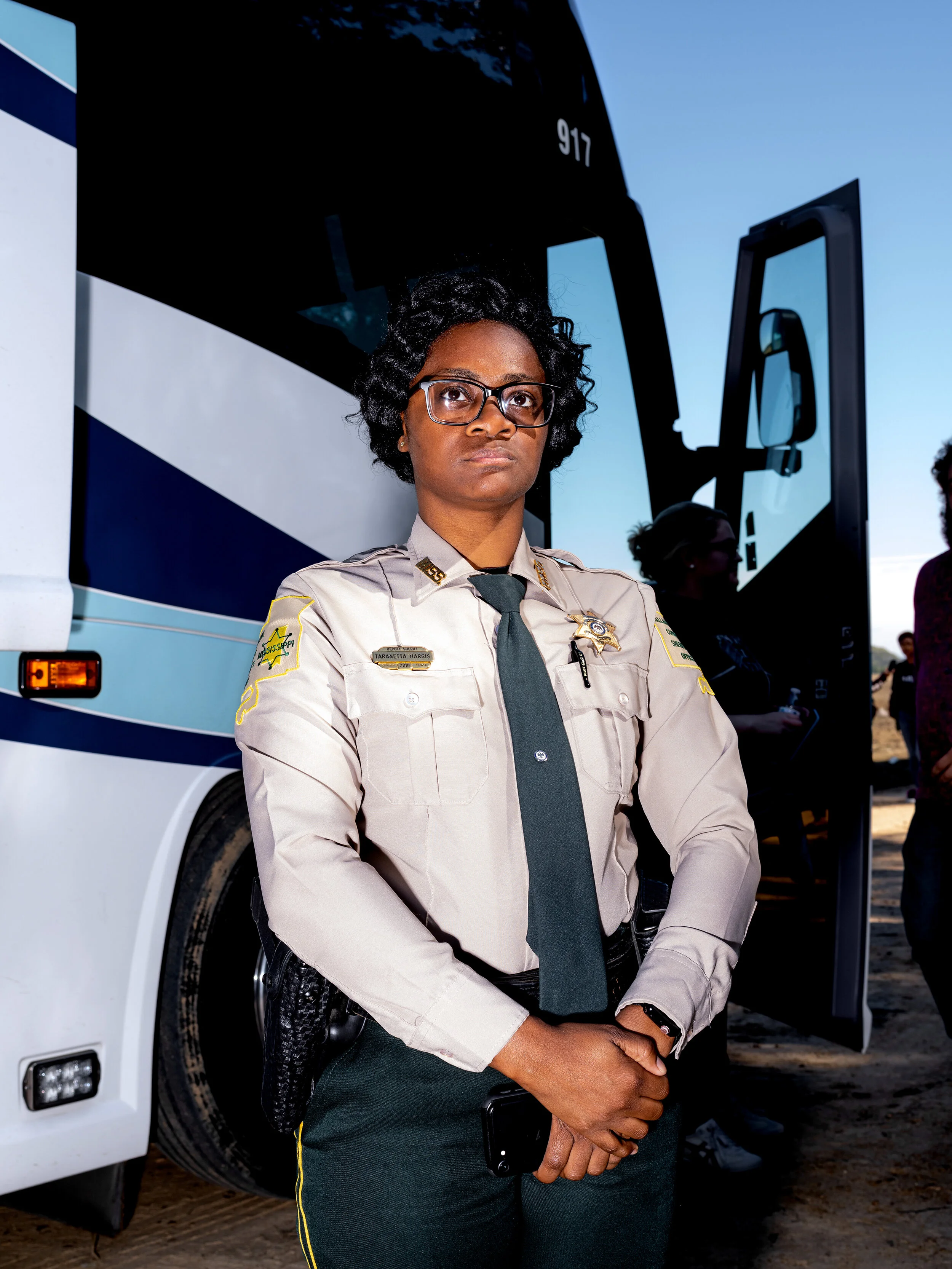  A Tallahatchie County Deputy Sheriff views the newly erected Emmett Till commemorative marker during the re-dedication ceremony. 