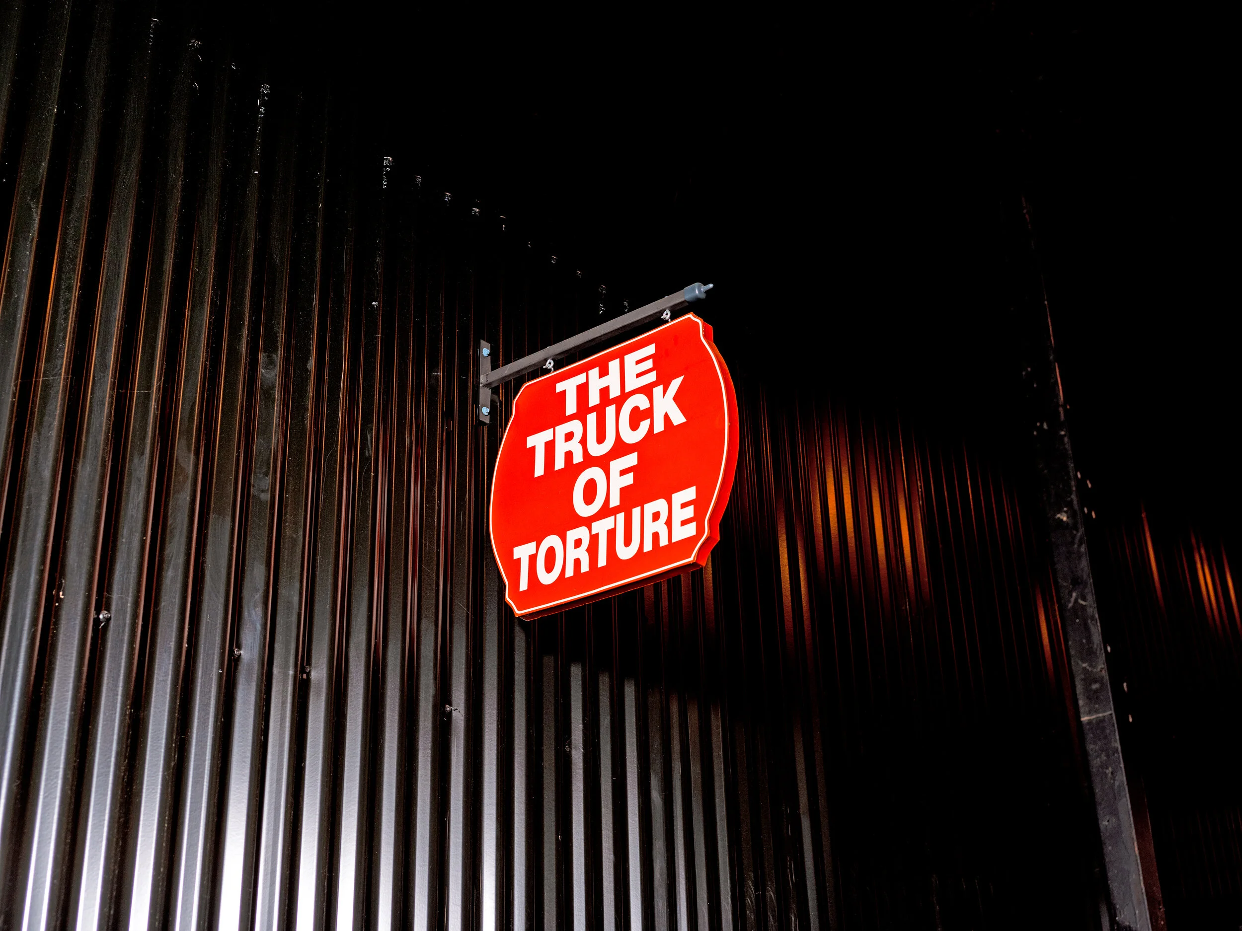  A  title piece hangs above a replica of J.W. Milam’s pickup truck at the E.T.H.I.C. Museum in Glendora, Mississippi. 