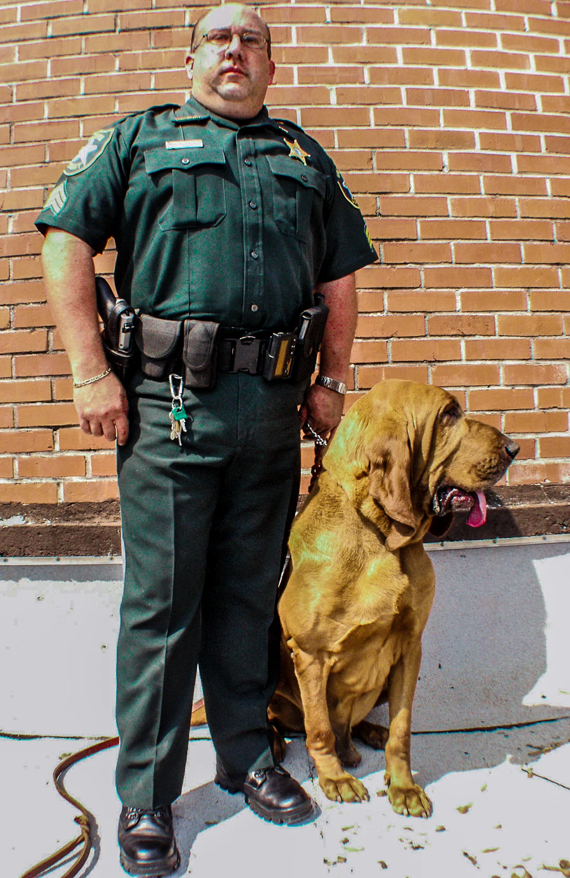  The Law and His Best Friend: Sgt. Tim Ball and partner PuddinÕ sniff out both crime suspects and missing people as employees with the Columbia County SheriffÕs Department in Florida. "We have the best bloodhound in the Southeastern United States, No