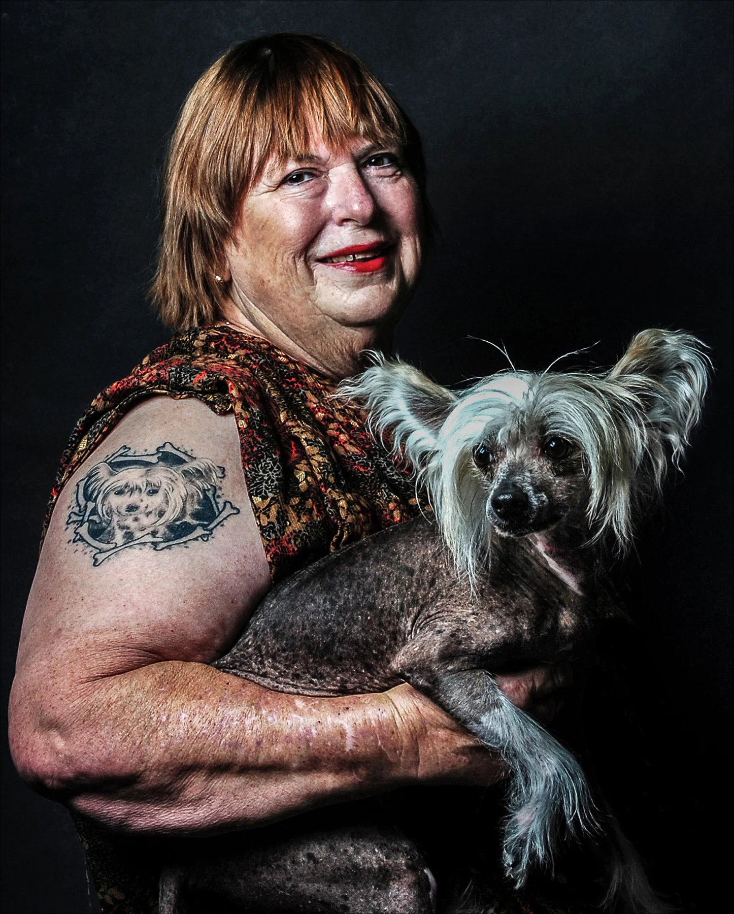  Sally Jo Daniels, 64, has tattooed on her arm a portrait of her Chinese crested hairless dog, Albert. 