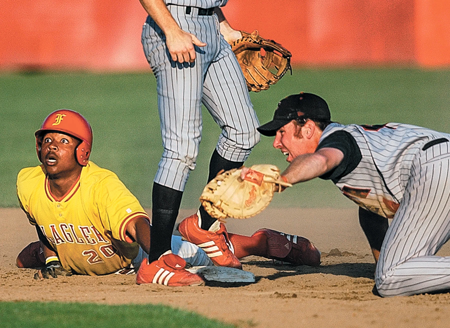  Flagler’s Glenn Kiture (20) is called out at second after Valdosta State’s Jud Seymour dove in for the tag during the game on Wednesday evening, April 13, 2005. Photo by MADELYN TROYANEK, madelyn.troyanek@staugustinerecord.com 