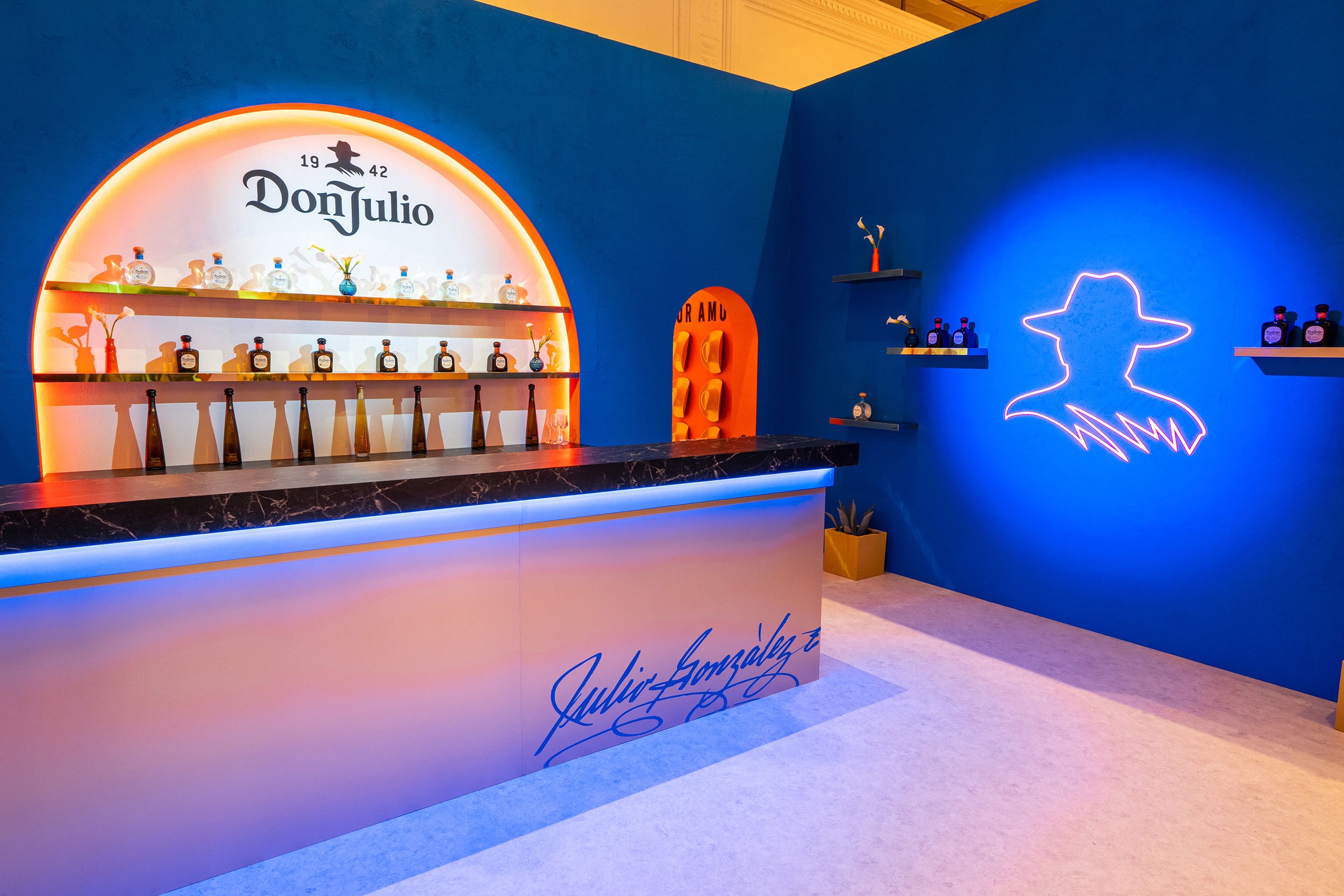 Interior of the Don Julio branded environment fabricated by McWood for World Class 2025, featuring custom architectural finishes, illuminated branding, premium display elements, and a bespoke hospitality experience.