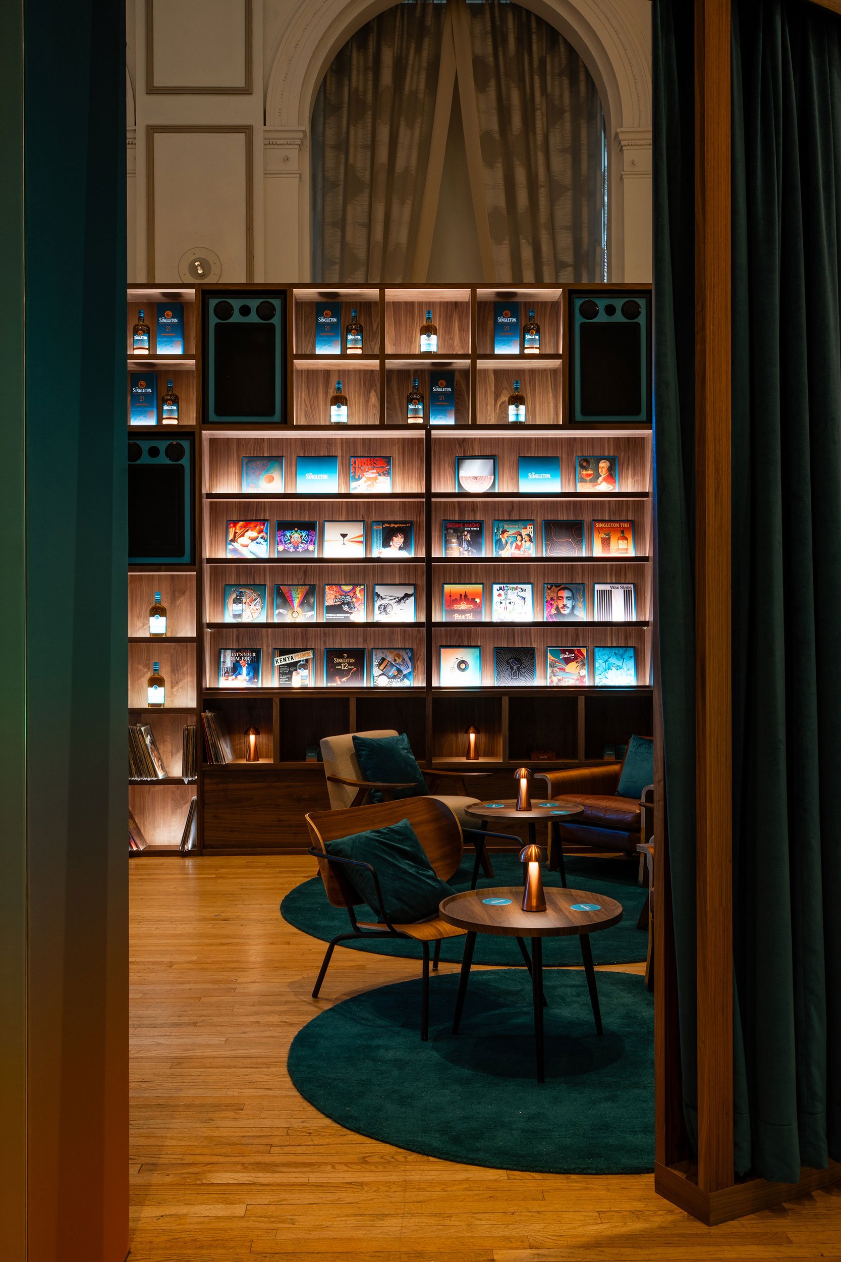 Singleton branded lounge fabricated by McWood for World Class 2025, featuring custom architectural finishes, illuminated branding, premium lounge furnishings, and an inviting hospitality environment at Toronto's Fairmont Royal York Hotel.