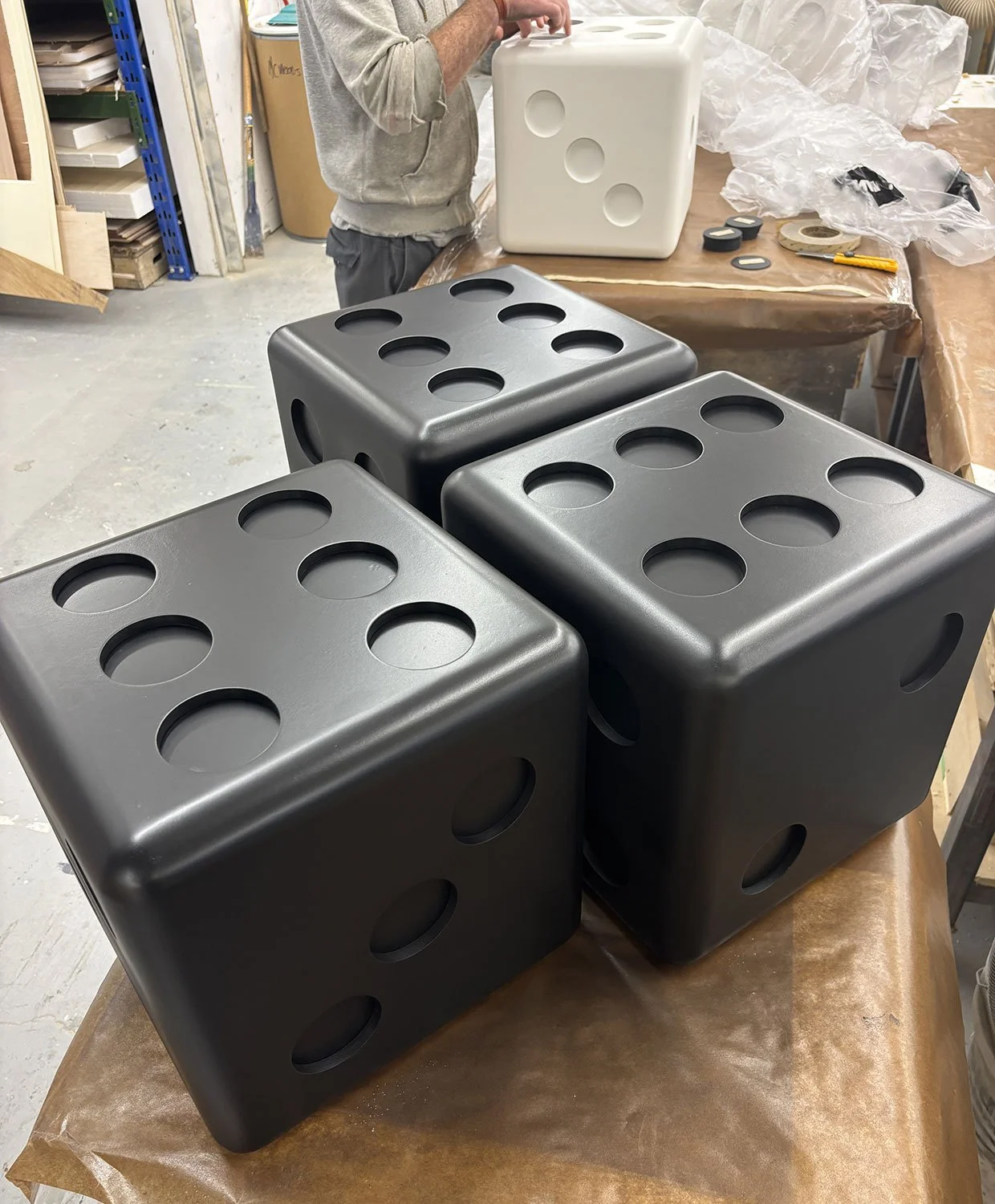 Oversized wooden dice under construction in the McWood workshop during fabrication for the custom Jo Malone London board game display at Holt Renfrew Centre in Toronto.