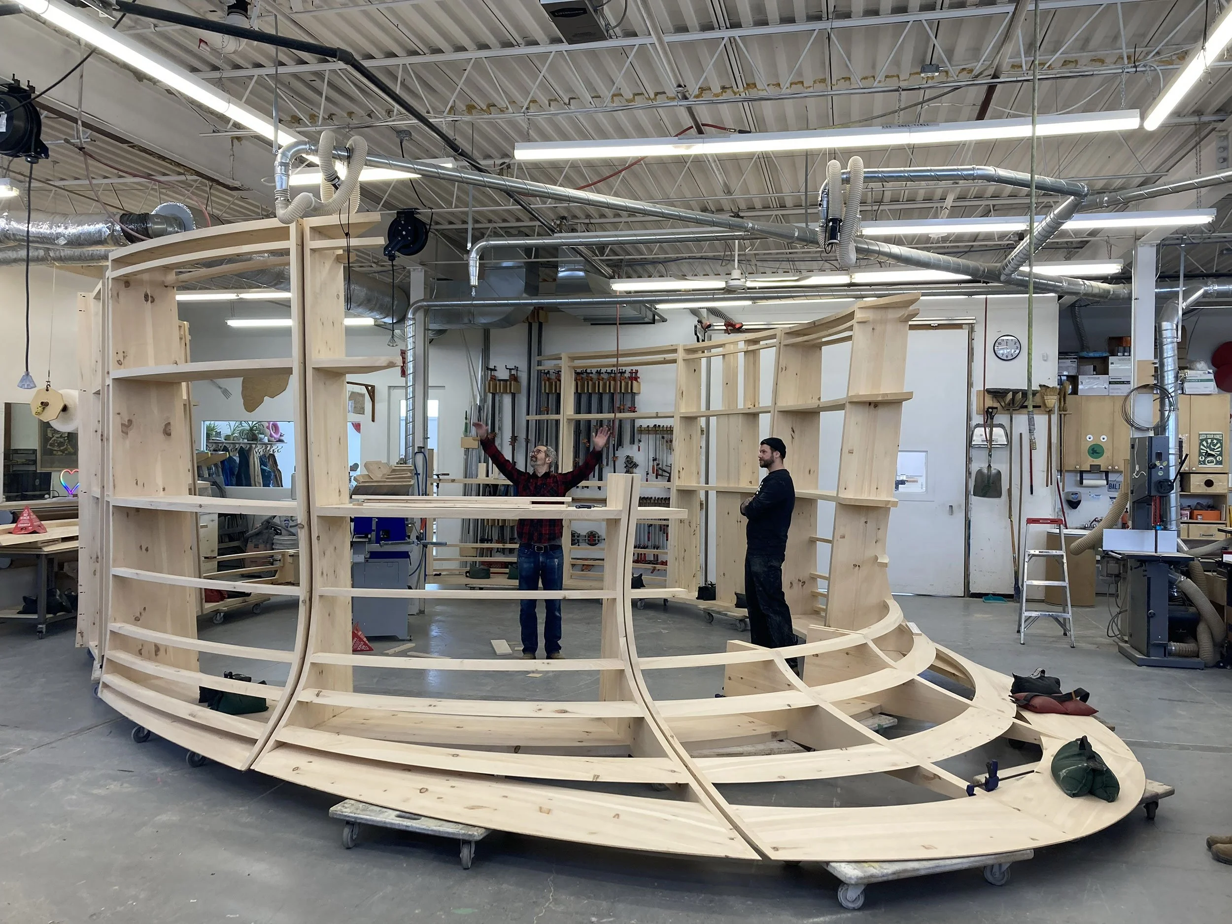 Skeletal timber structure under construction by McWood for Chris Cornelius's installation at the Gardiner Museum in Toronto.