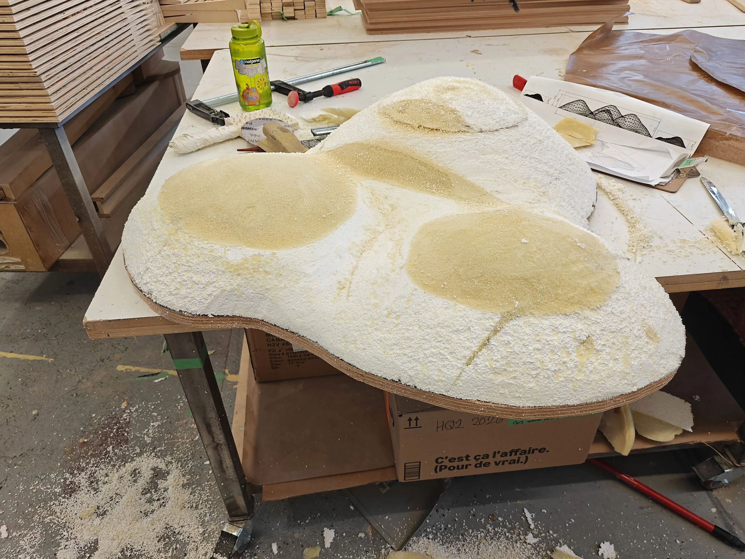 Under construction of McWood's custom grassy mound for the Jo Malone London English Pear pop-up, fabricated to fit the curved roof of a vintage VW van in Toronto.