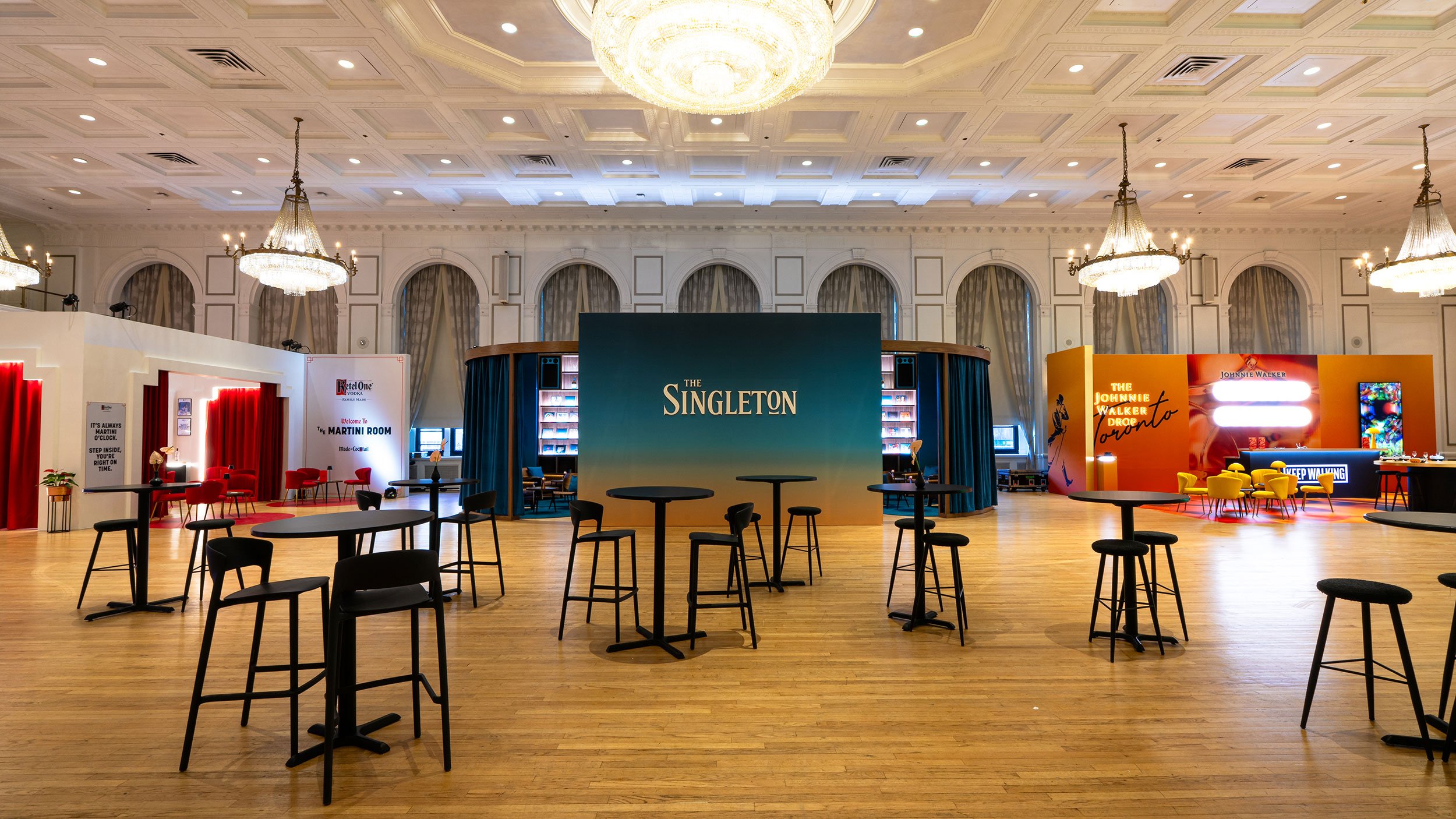 Multiple branded competition environments fabricated by McWood for the World Class 2025 global bartending competition at Toronto's Fairmont Royal York Hotel, featuring custom bars, LED signage, fabric SEG screens, graphics, and event branding.