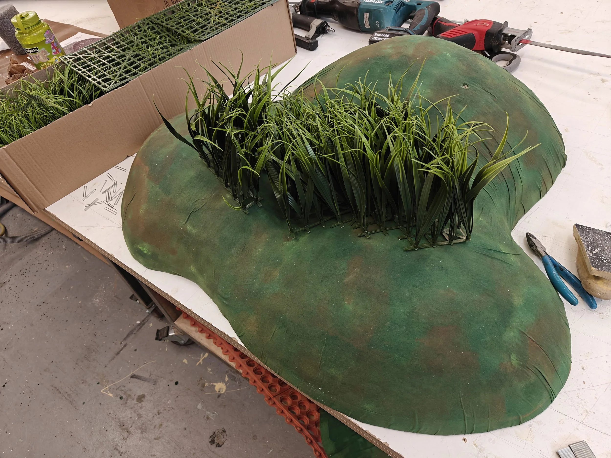 McWood fabricating the custom grassy knoll for the Jo Malone London English Pear pop-up, engineered to mount securely to a vintage VW van without mechanical fasteners in Toronto.