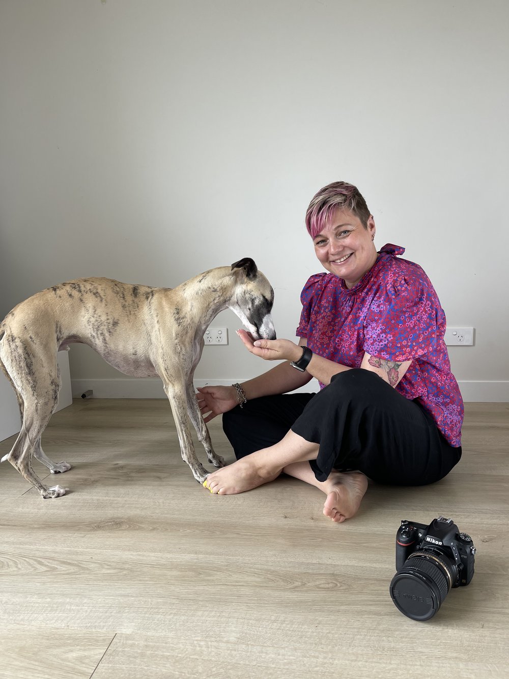 photographer with whippet