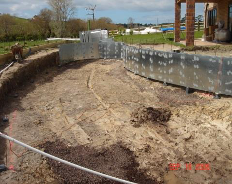 Excavation and walls being formed